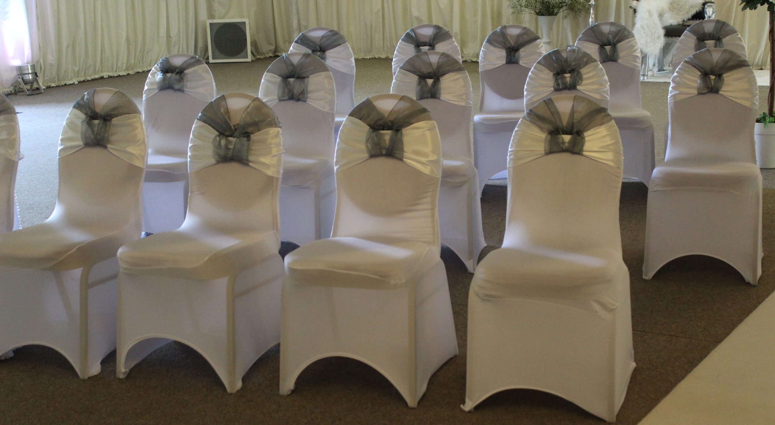 Wedding decor hire, chair sashes in aisle room, white and silver