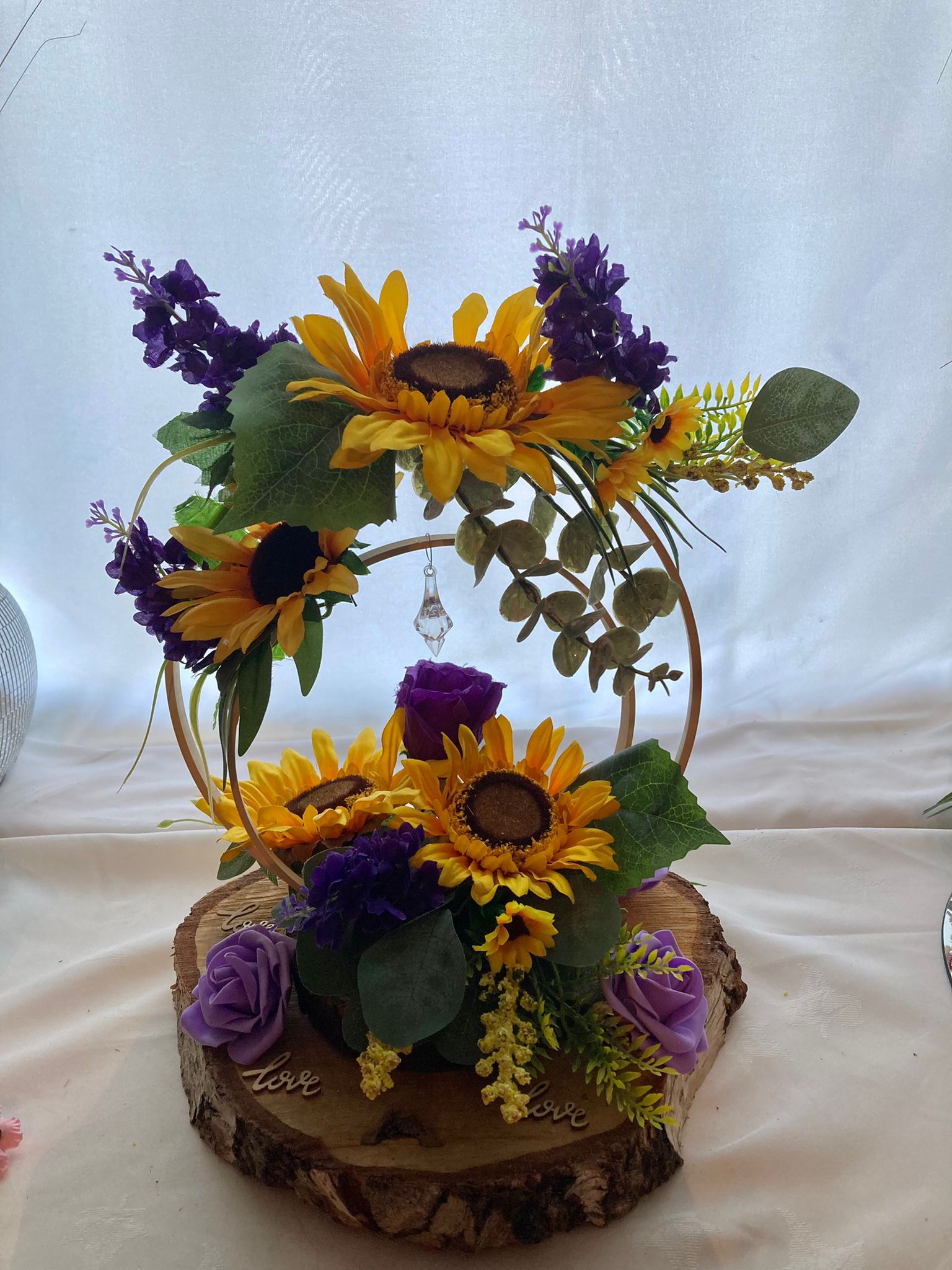 Wooden hoop centrepieces with sunflowers