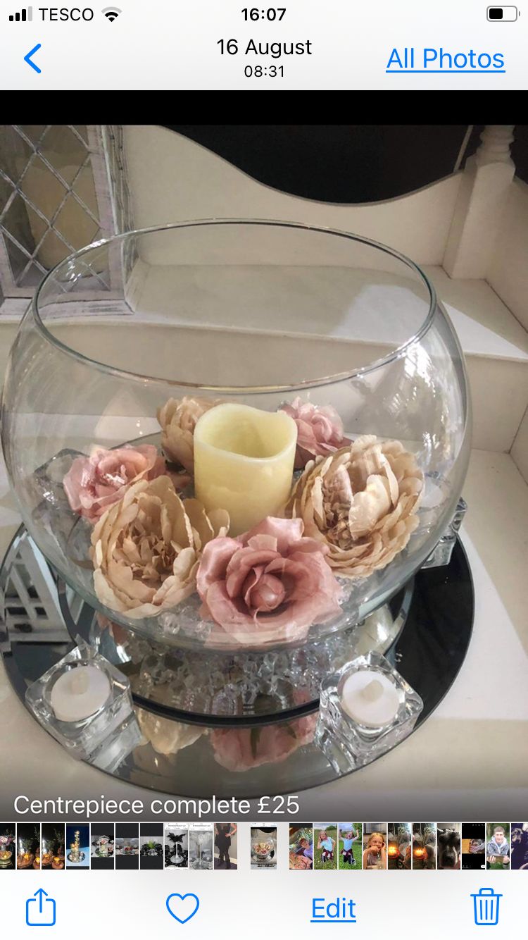Fishbowl centrepiece with pink roses and candle