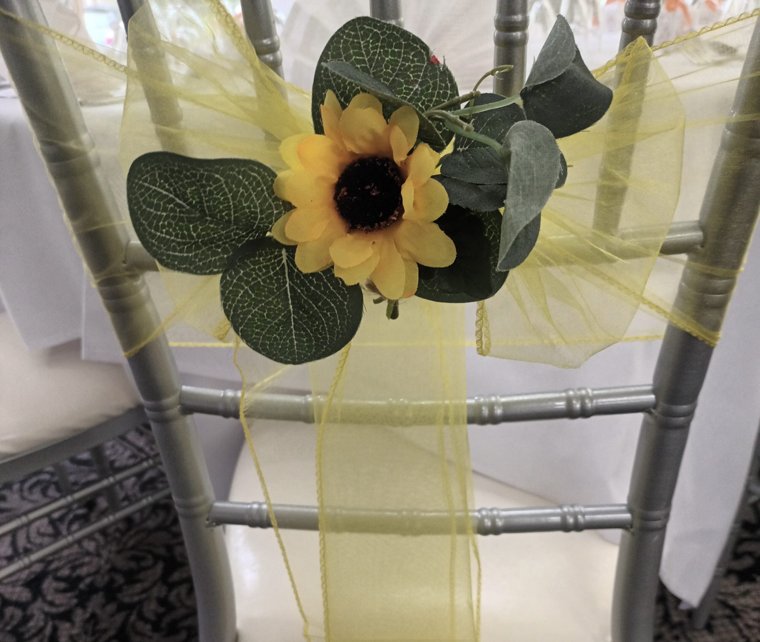 Large sunflower embellishment on yellow sash
