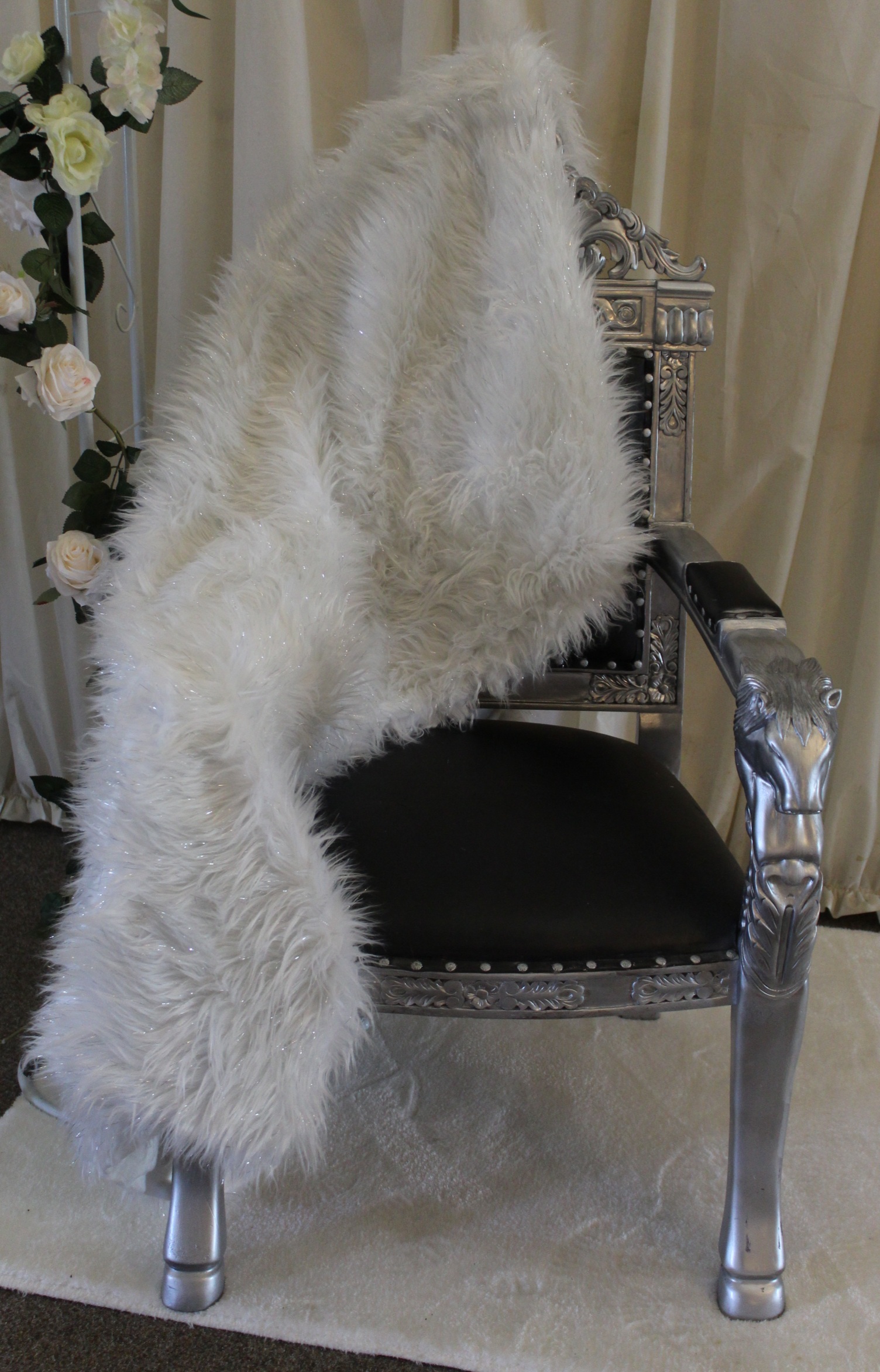 Throne chair for winter wonderland wedding covered in fur rug