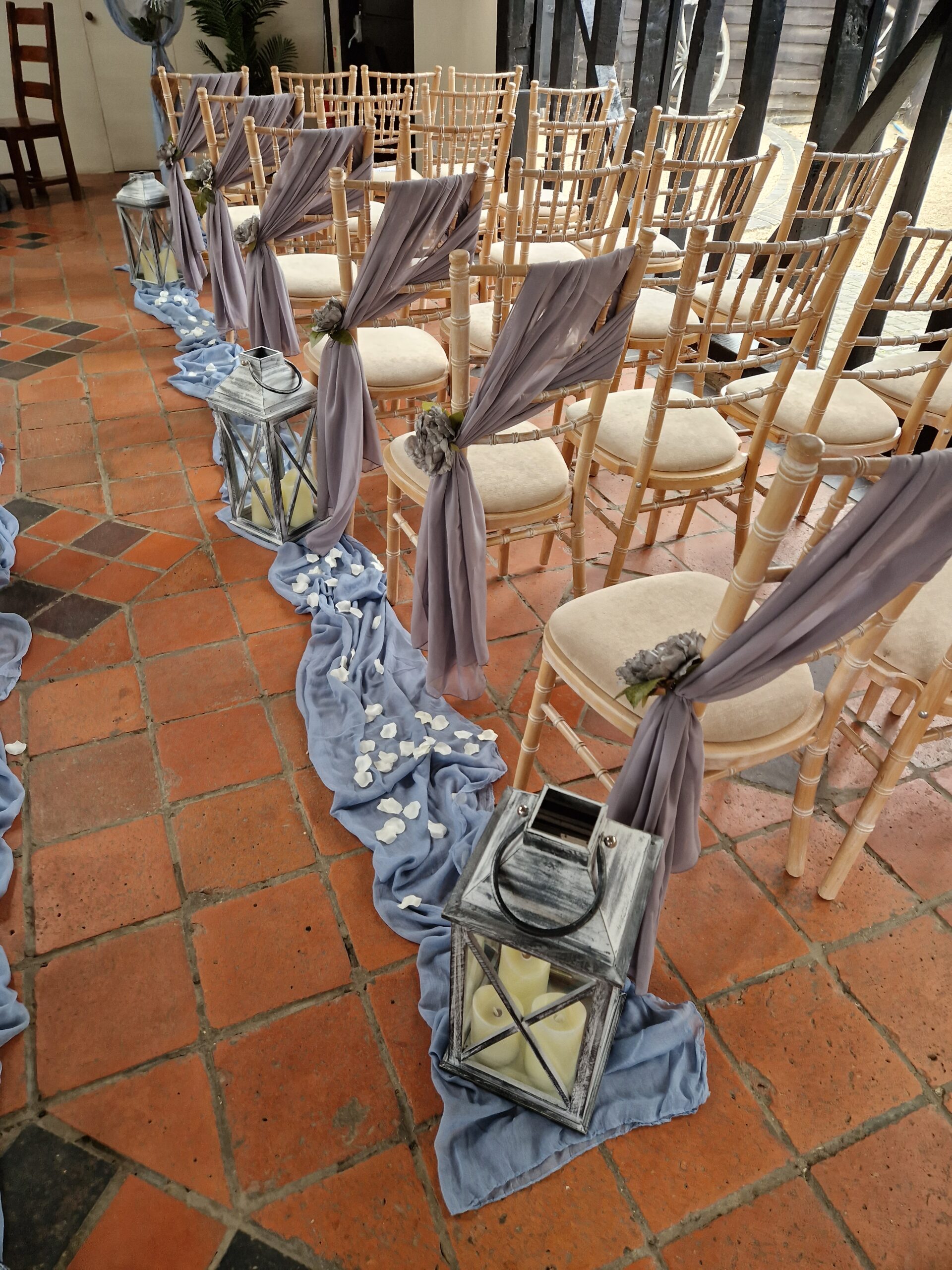 Silver grey chair drapes, tied at the side
