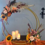 Alternative cake stand, metal hoop design with candles and flower displays